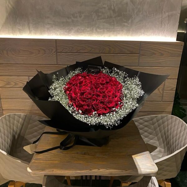 LF 100 Red Roses Hugged By Gypsophila