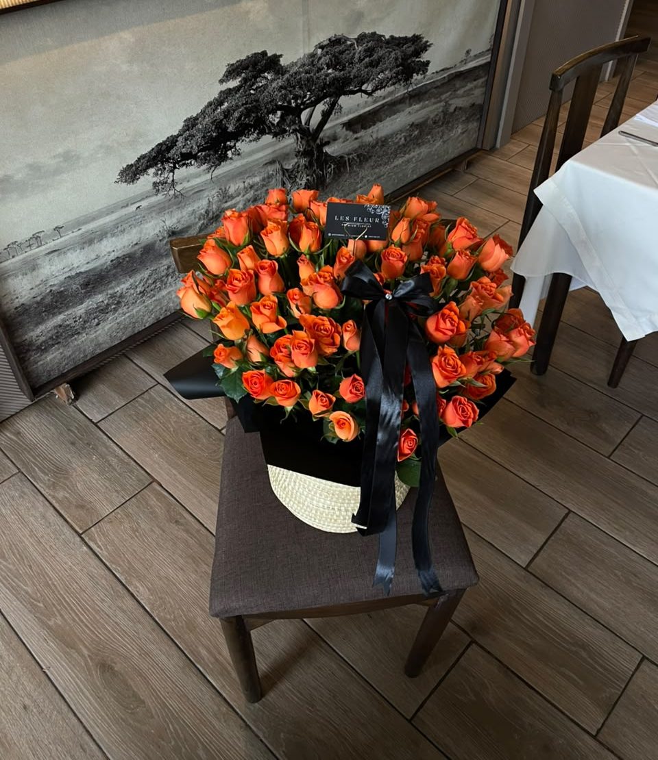 Sunset Royale – LF 100 Stem Orange Rose Basket Arrangement